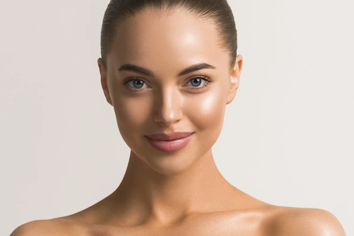 Woman showing brighter complexion after Erbium Laser Resurfacing treatment in Cornelius, NC
