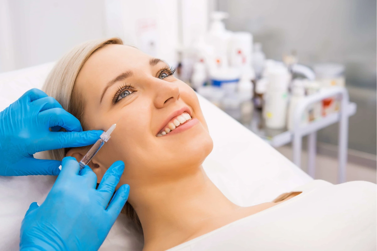 Woman getting Botox treatment to reduce facial wrinkles
